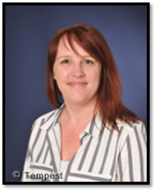 Mrs Harris wearing a striped blouse